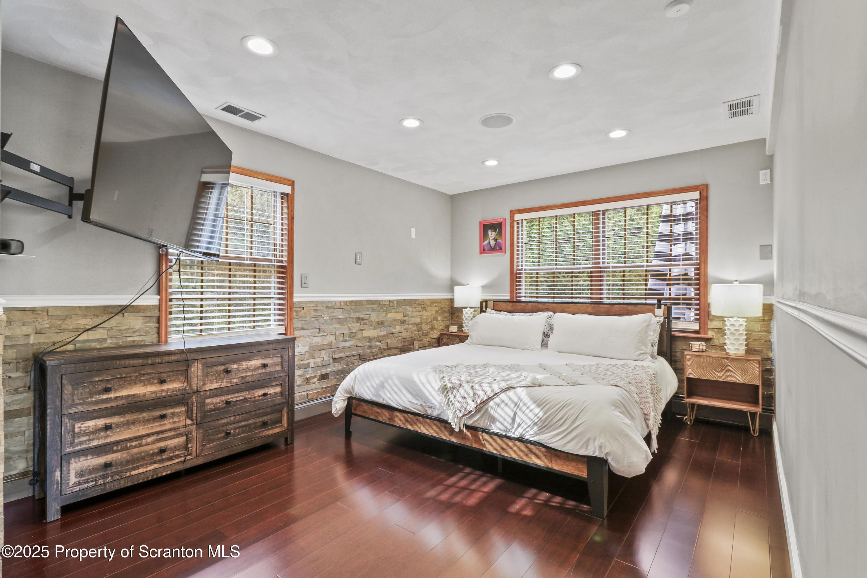 1509 Creek Road New Milford, PA 18834 - Photo 27 of 64 a bedroom with a bed and wooden floor