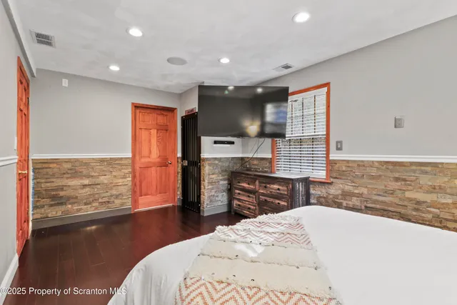 a living room with lots of furniture and a flat screen tv