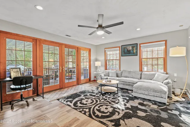 a living room with furniture and a window