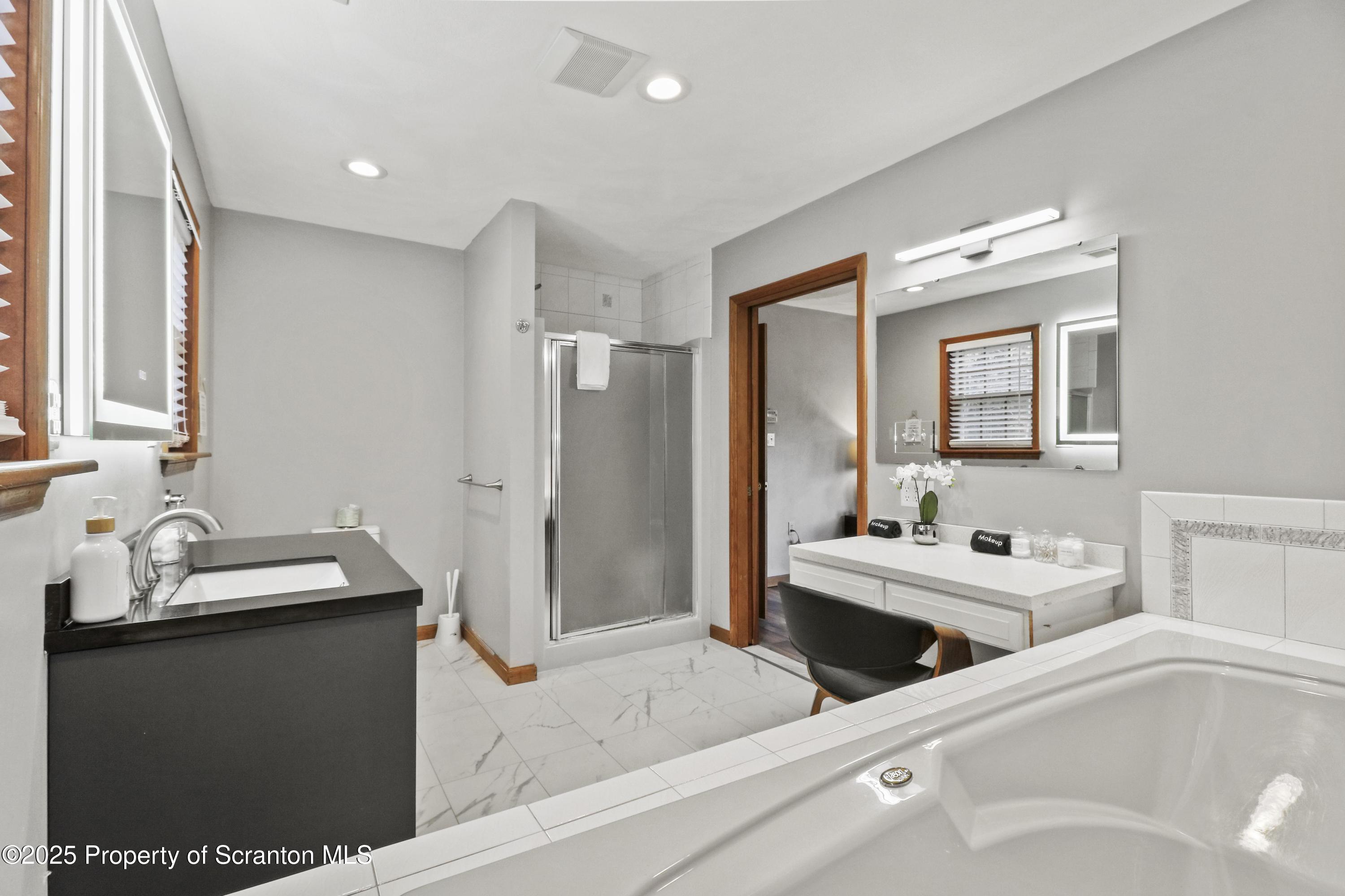 1509 Creek Road New Milford, PA 18834 - Photo 32 of 64 a en suite bathroom with a sink and a mirror