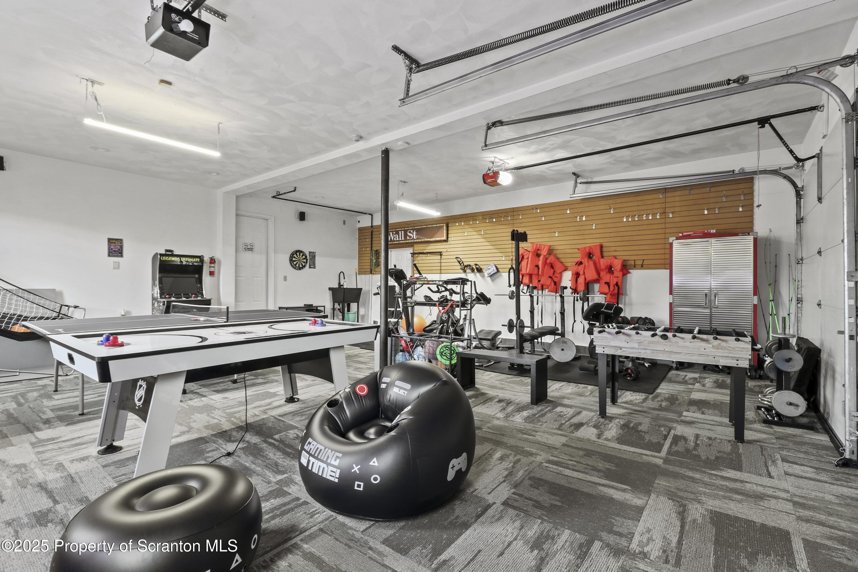 1509 Creek Road New Milford, PA 18834 - Photo 37 of 64 a room with lots of furniture and a wooden floor