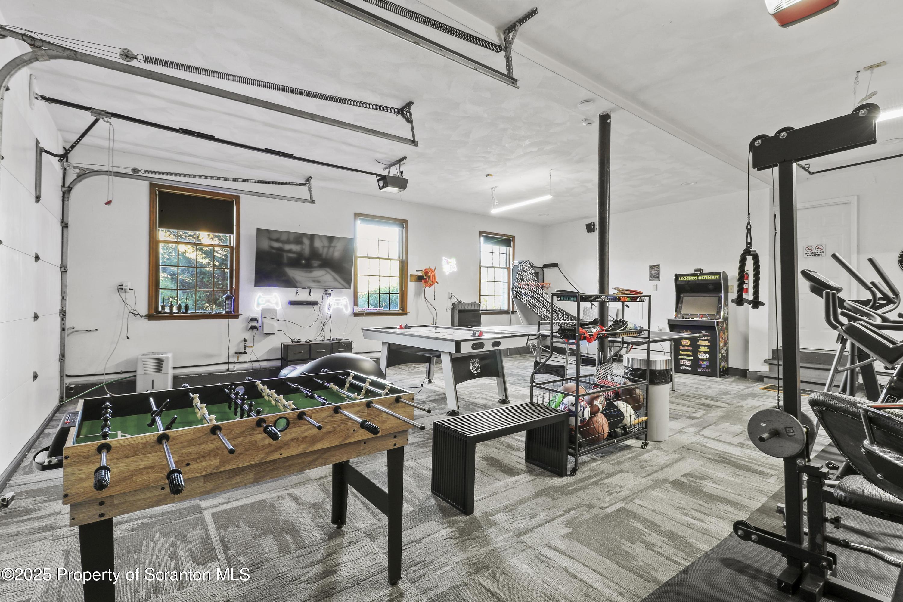 1509 Creek Road New Milford, PA 18834 - Photo 38 of 64 a living room with lots of furniture and a flat screen tv