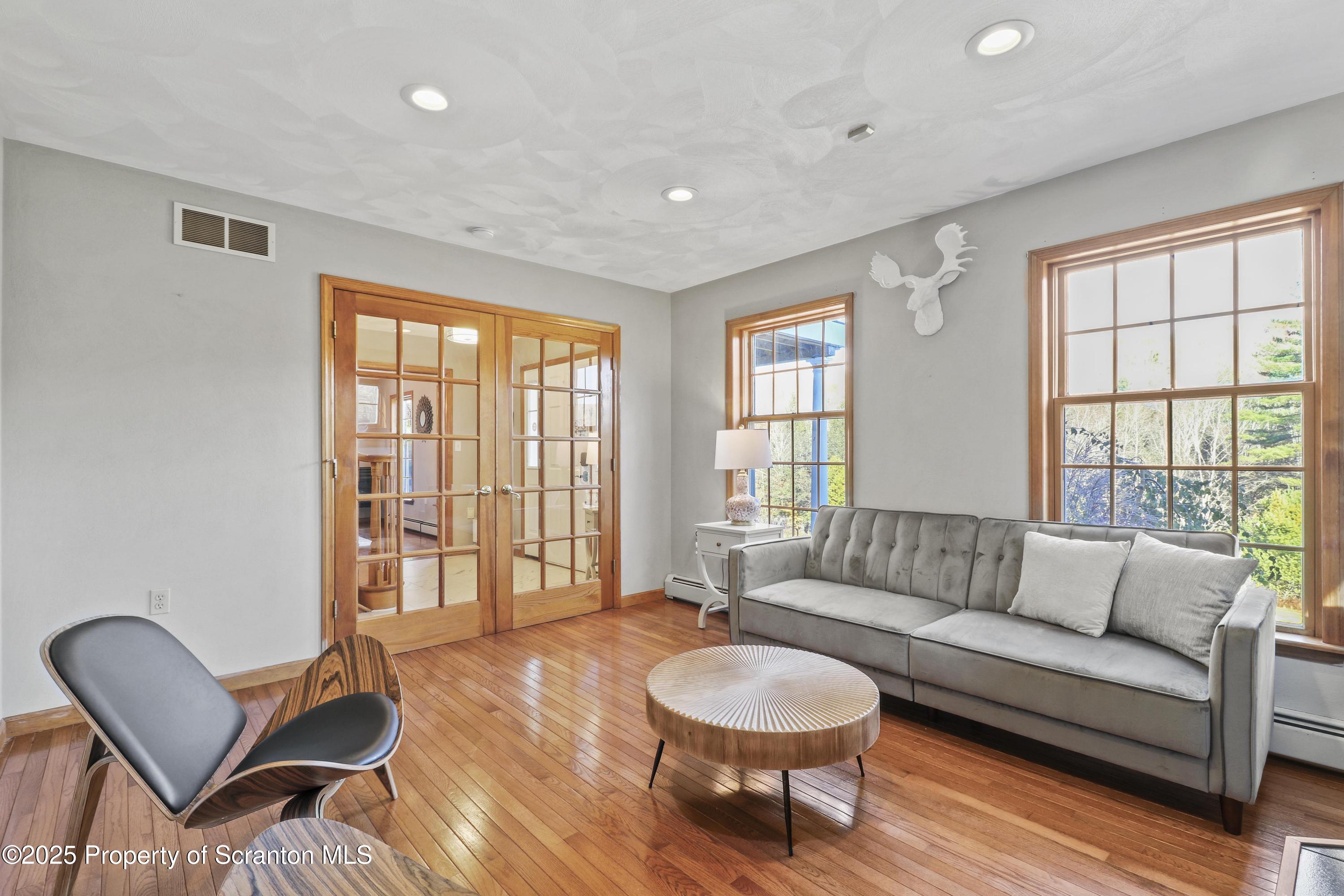 1509 Creek Road New Milford, PA 18834 - Photo 4 of 64 a living room with furniture and a window