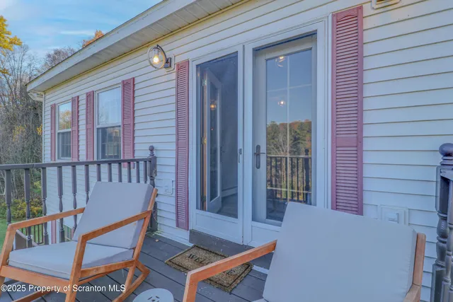 a swimming pool with outdoor seating and yard