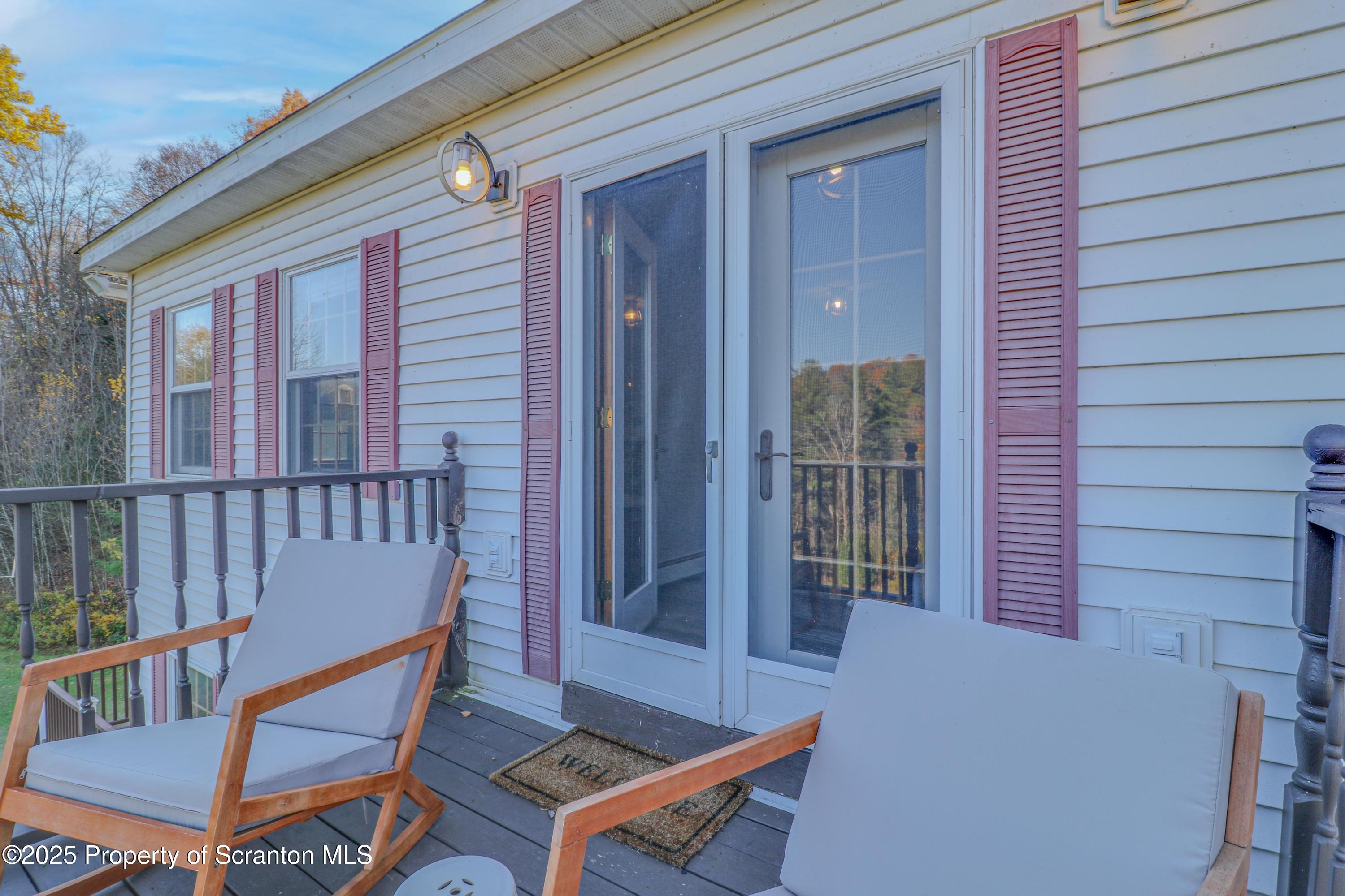 1509 Creek Road New Milford, PA 18834 - Photo 43 of 64 a view of a chair and table in the balcony