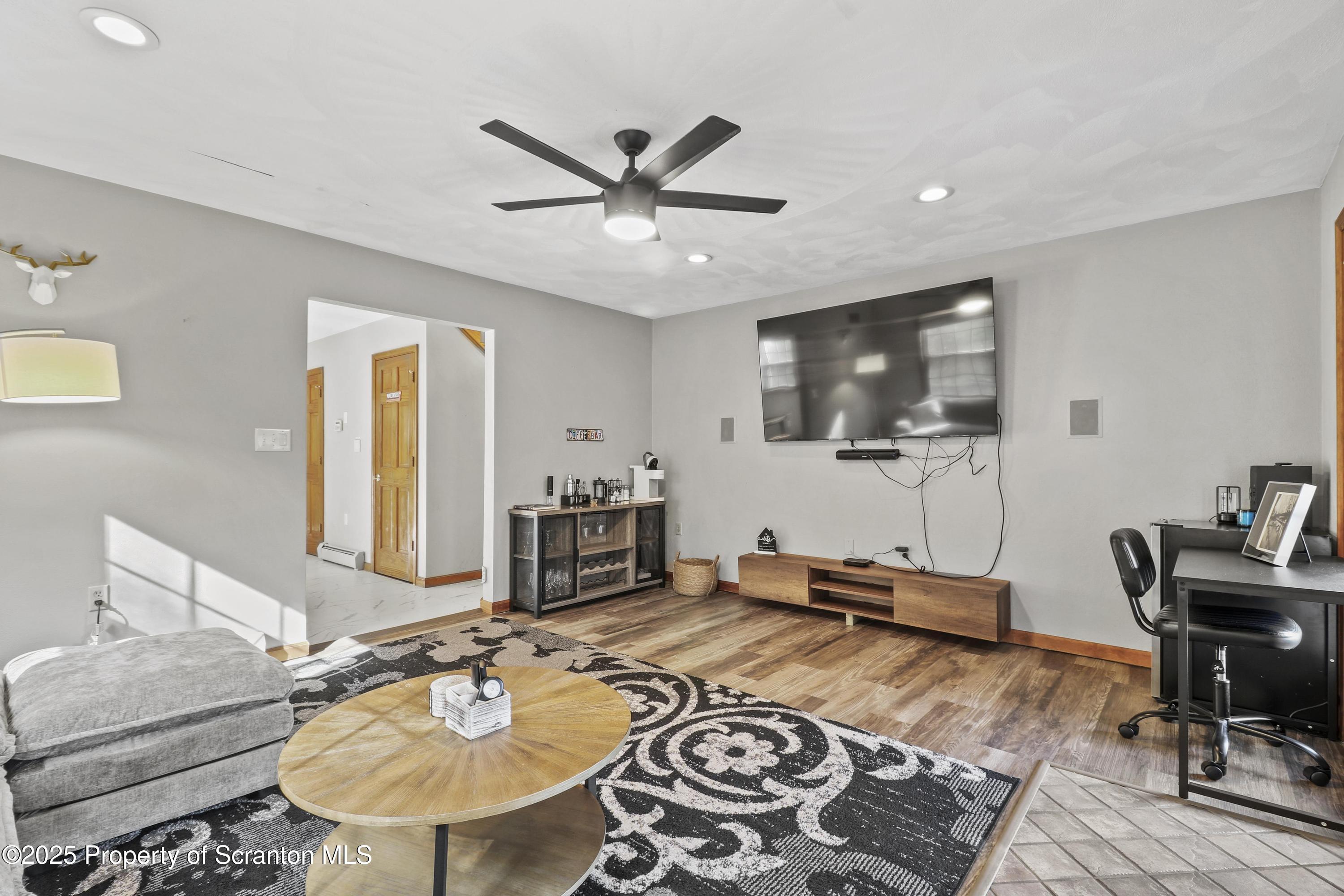 1509 Creek Road New Milford, PA 18834 - Photo 5 of 64 a living room with furniture and flat screen tv