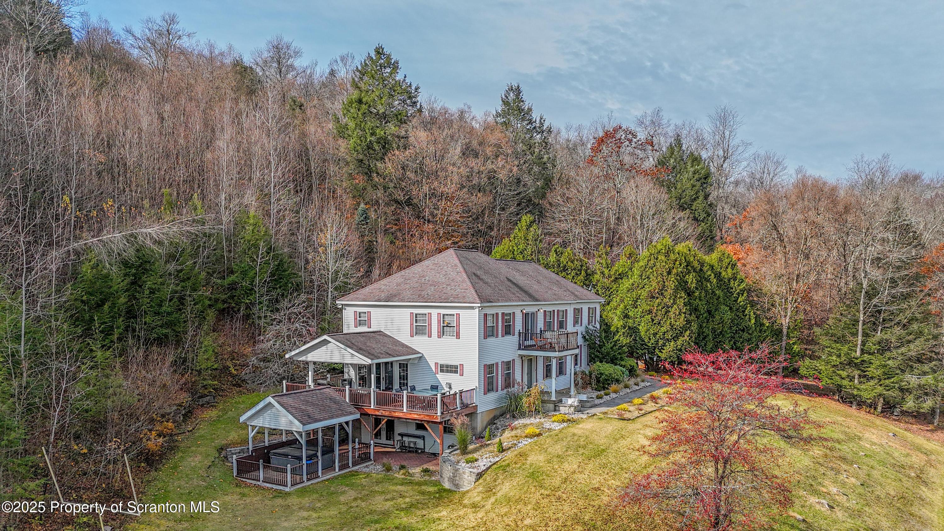 1509 Creek Road New Milford, PA 18834 - Photo 57 of 64 a aerial view of a house with swimming pool and large trees