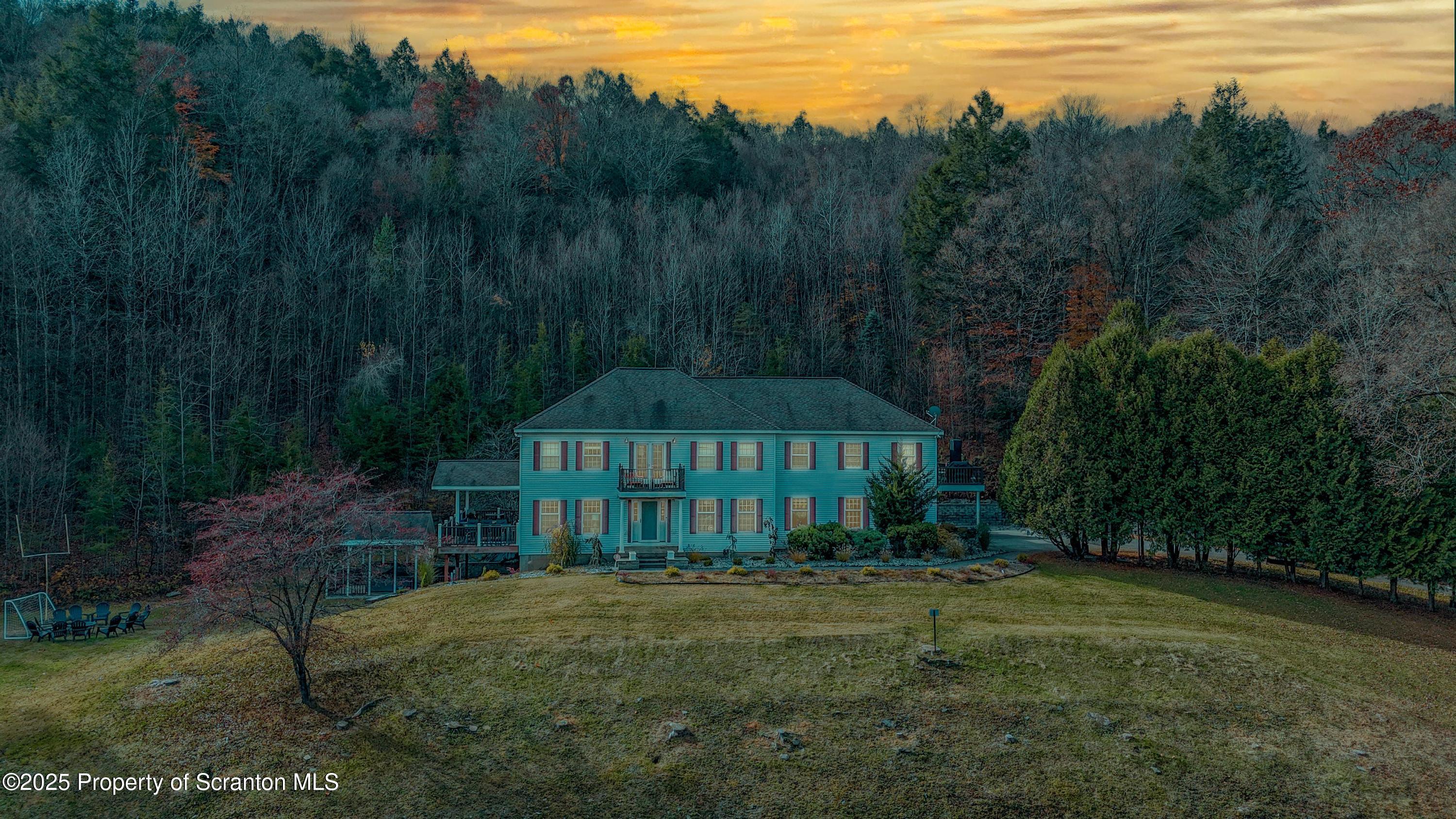 1509 Creek Road New Milford, PA 18834 - Photo 63 of 64 a front view of a house with yard and green space