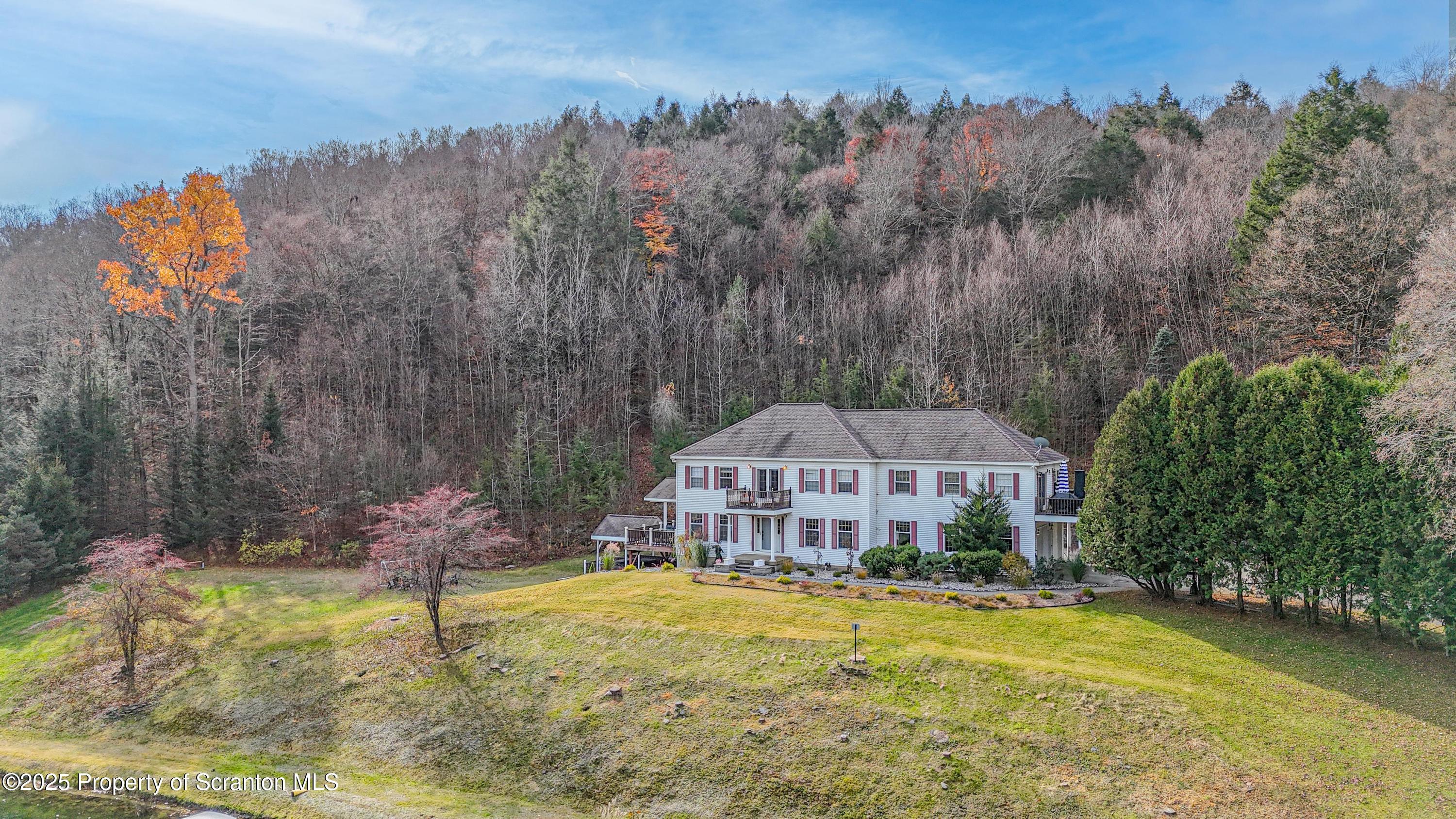 1509 Creek Road New Milford, PA 18834 - Photo 64 of 64 an aerial view of a house with swimming pool and large trees