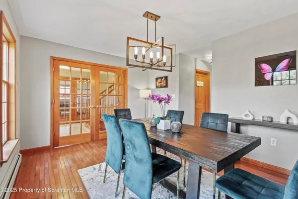 a kitchen with white cabinets and appliances