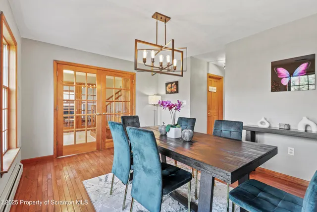 a kitchen with white cabinets and appliances