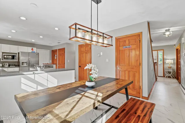 a bathroom with a sink mirror and vanity