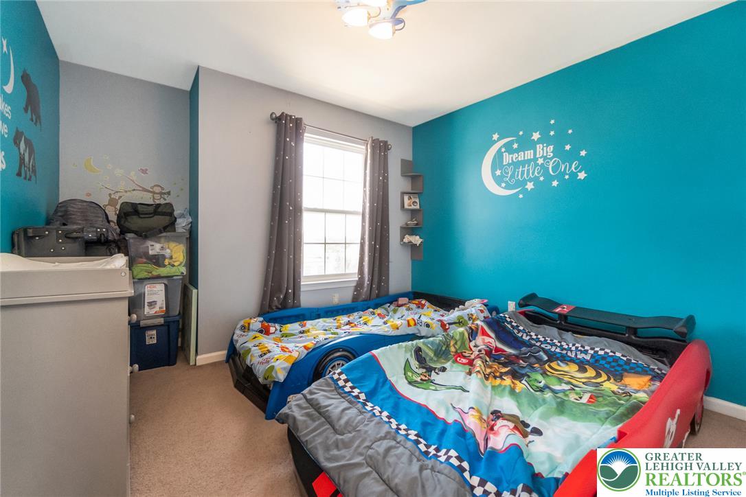 3566 Penfield Way Nazareth, PA 18064 - Photo 35 of 47 A cheerful children's bedroom offers ample natural light and vibrant, playful decor.