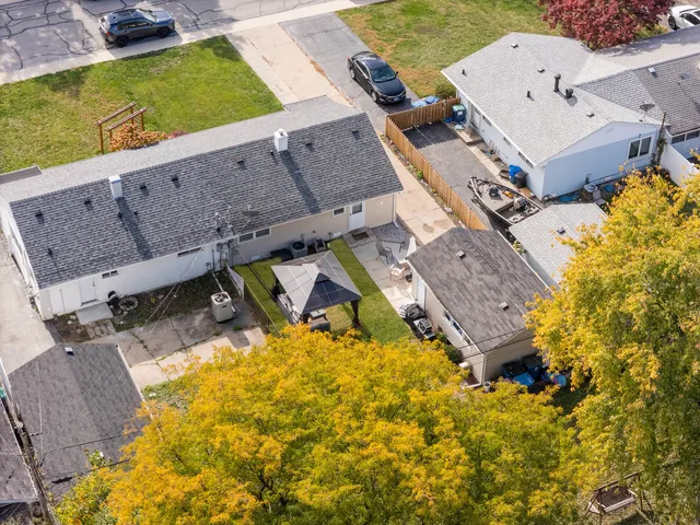 an aerial view of a house with a swimming pool