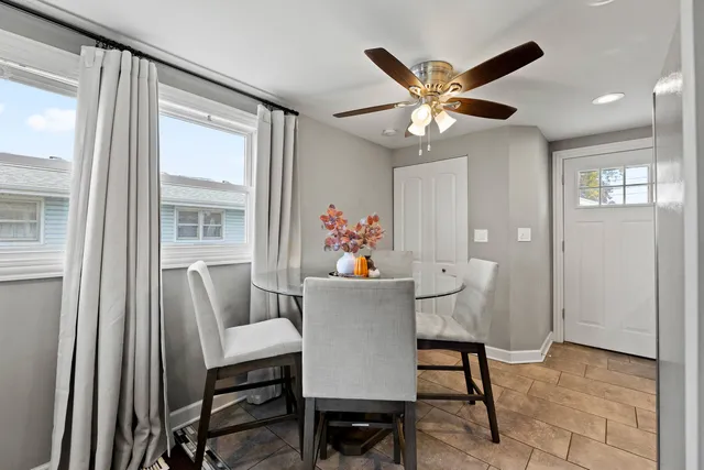 a dining room with furniture and window