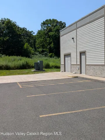 a view of a yard with potted plants
