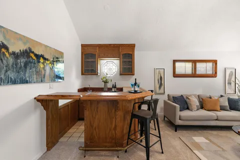 a view of a livingroom with furniture and window