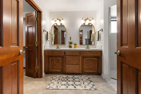a bathroom with a sink and a mirror