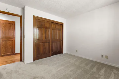 an empty room with closet area