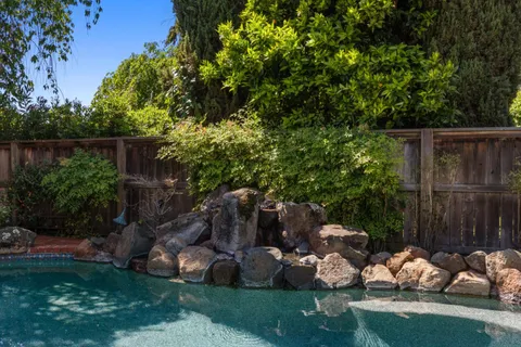 a backyard of a house with lots of green space