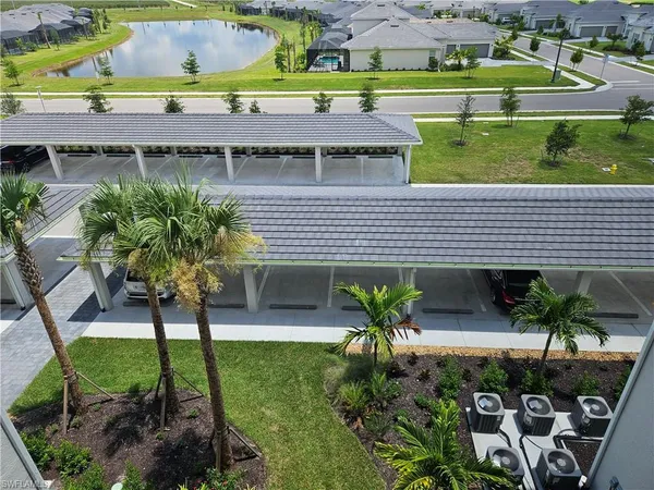 a view of a backyard with plants and a patio