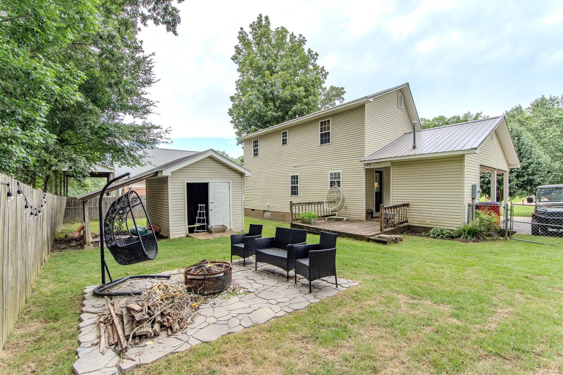 80 Tom Way Savannah, TN 38372 - Photo 16 of 33 a view of a backyard with a sitting area