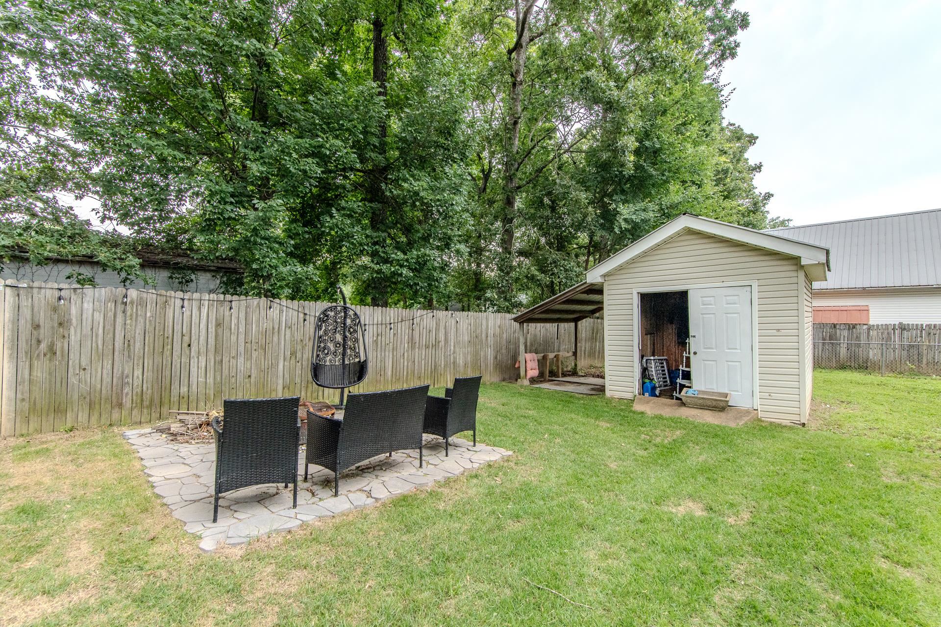 80 Tom Way Savannah, TN 38372 - Photo 17 of 33 a view of a chair and table in backyard of the house