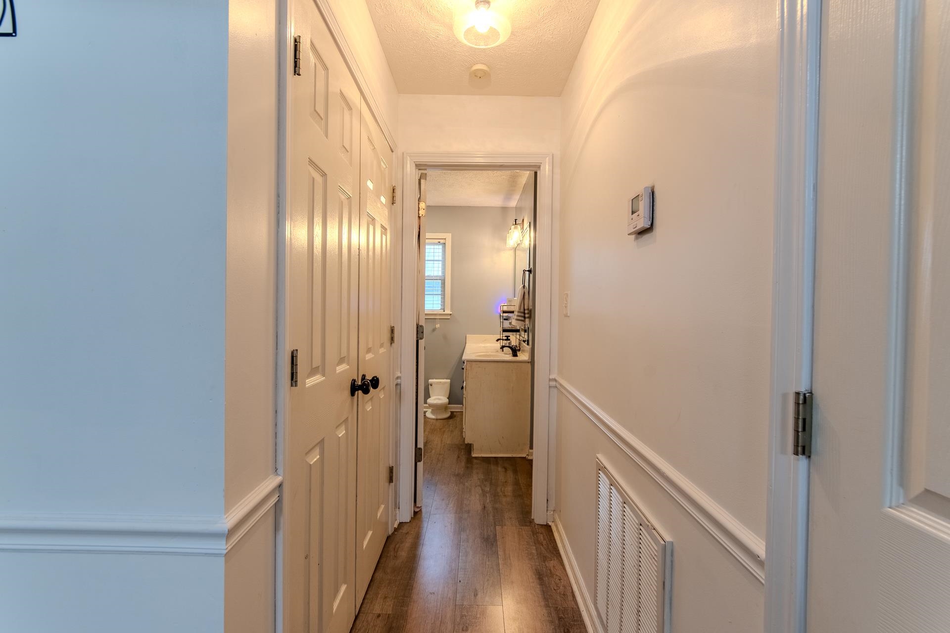 80 Tom Way Savannah, TN 38372 - Photo 19 of 33 a view of a hallway with a wooden floor