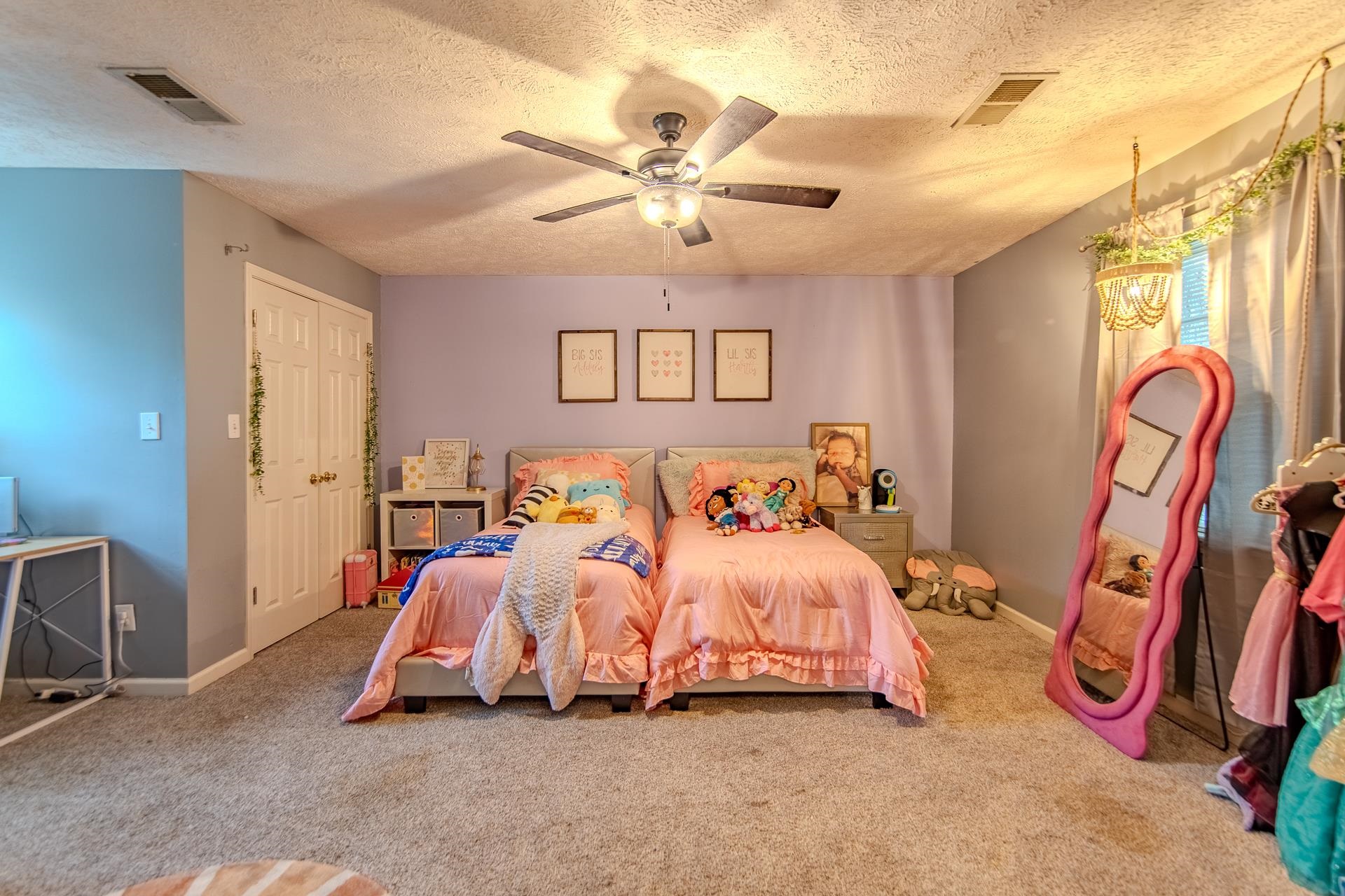 80 Tom Way Savannah, TN 38372 - Photo 27 of 33 a bedroom with bed and a chandelier