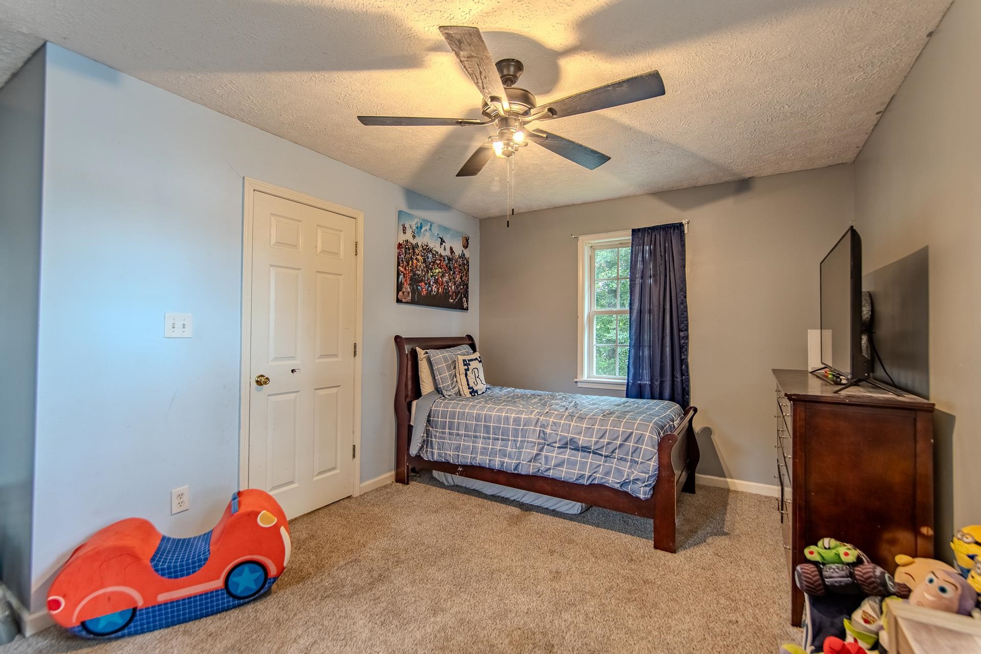 80 Tom Way Savannah, TN 38372 - Photo 29 of 33 a bedroom with a bed and a chandelier