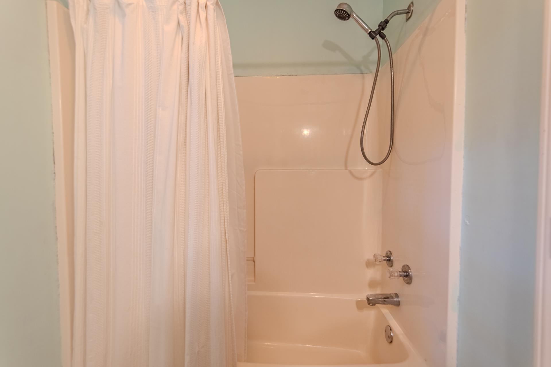 80 Tom Way Savannah, TN 38372 - Photo 32 of 33 a bathroom with a shower curtain