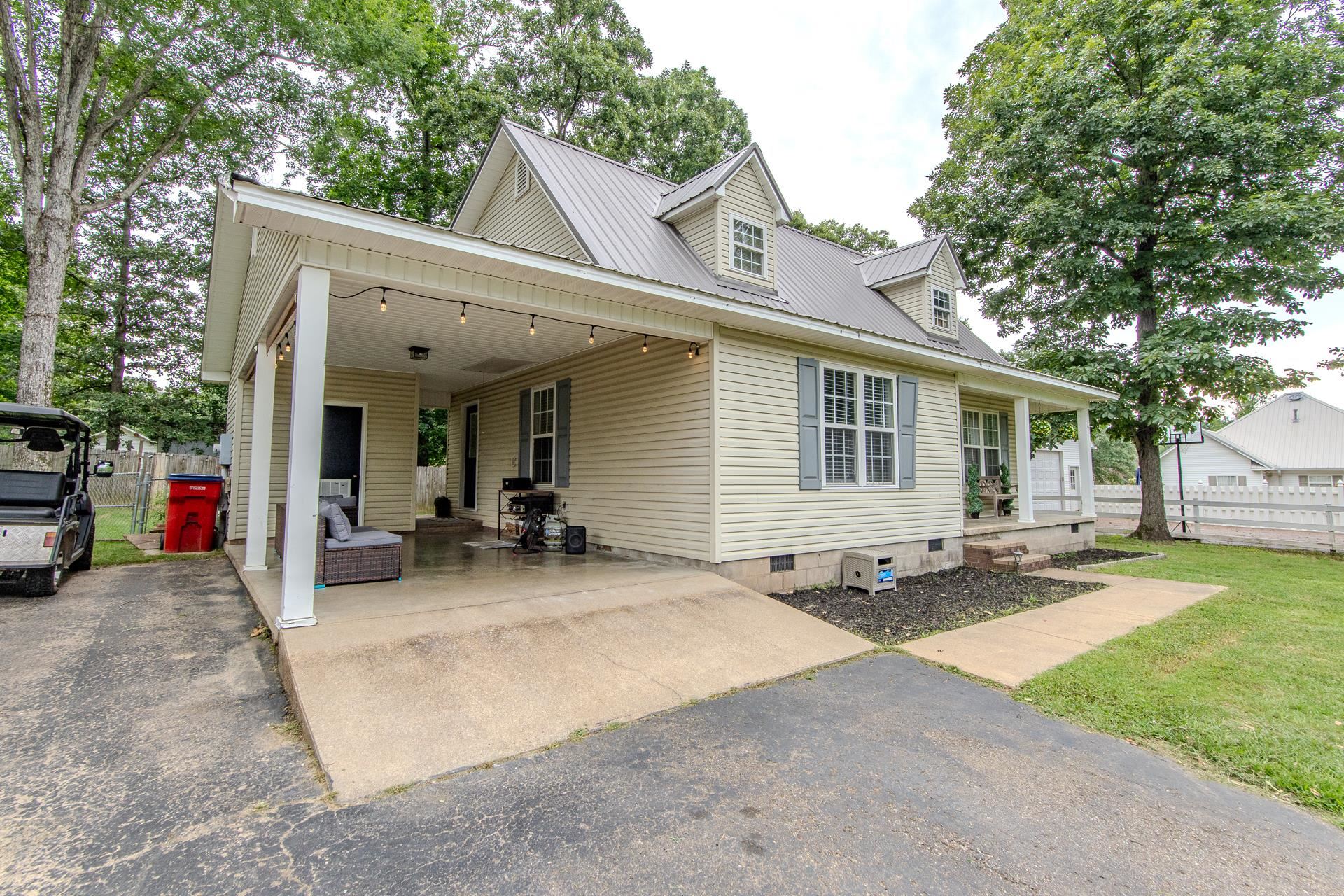 80 Tom Way Savannah, TN 38372 - Photo 4 of 33 a view of a house with patio