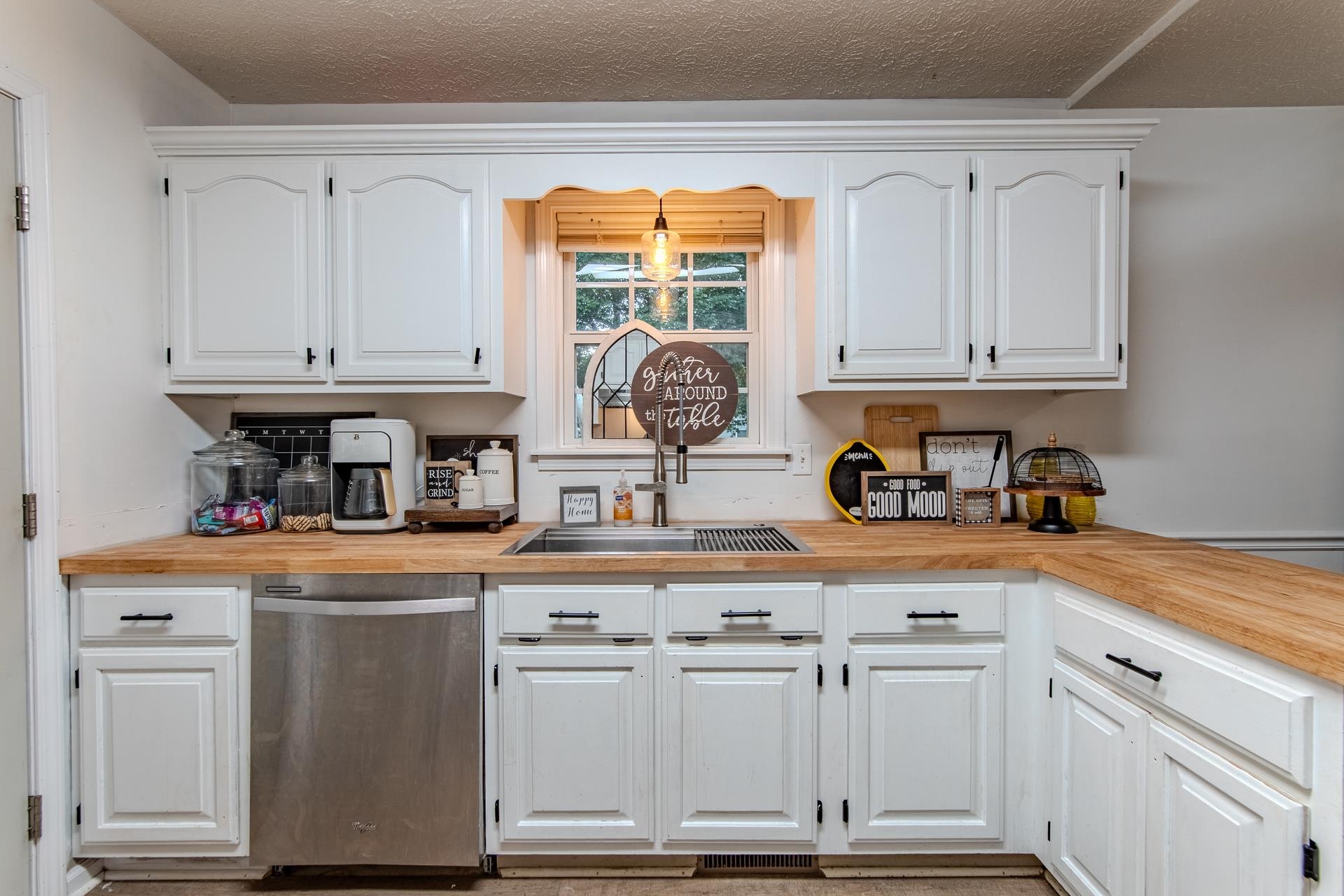 80 Tom Way Savannah, TN 38372 - Photo 6 of 33 a kitchen with white cabinets and white appliances