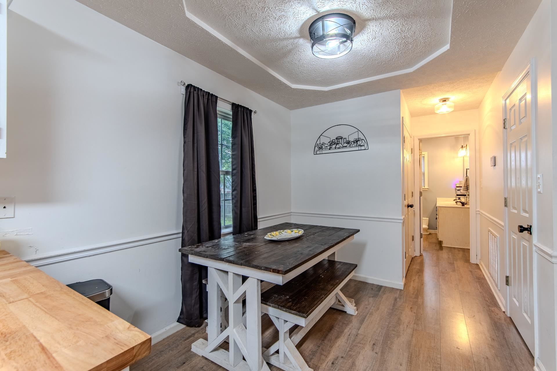 80 Tom Way Savannah, TN 38372 - Photo 7 of 33 a view of a hallway with furniture and wooden floor