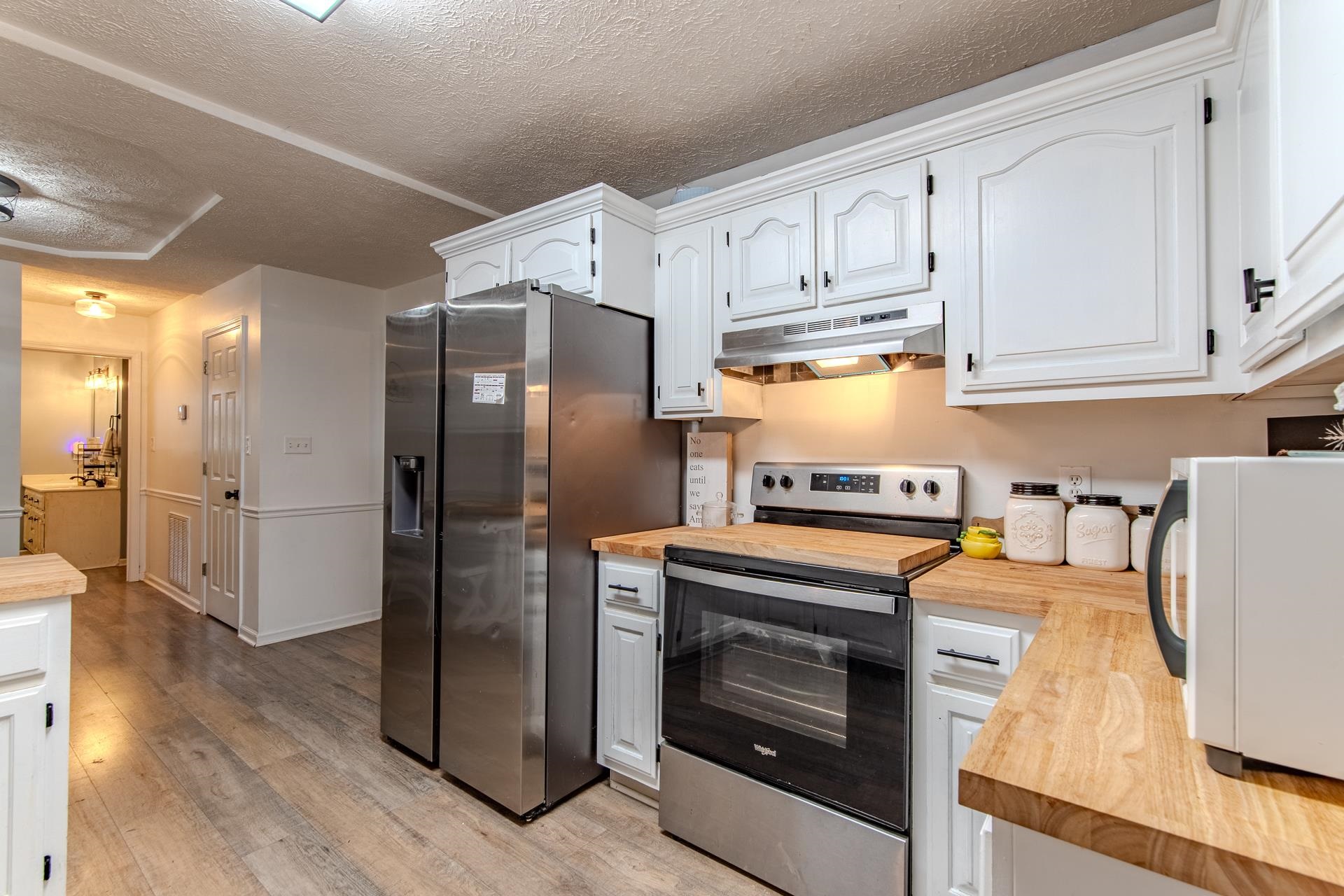 80 Tom Way Savannah, TN 38372 - Photo 8 of 33 a kitchen with stainless steel appliances a stove a refrigerator and cabinets
