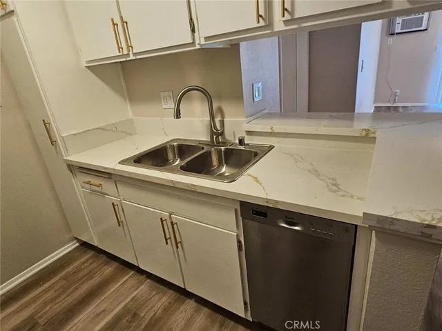 a close view of a sink a faucet and appliance in the kitchen