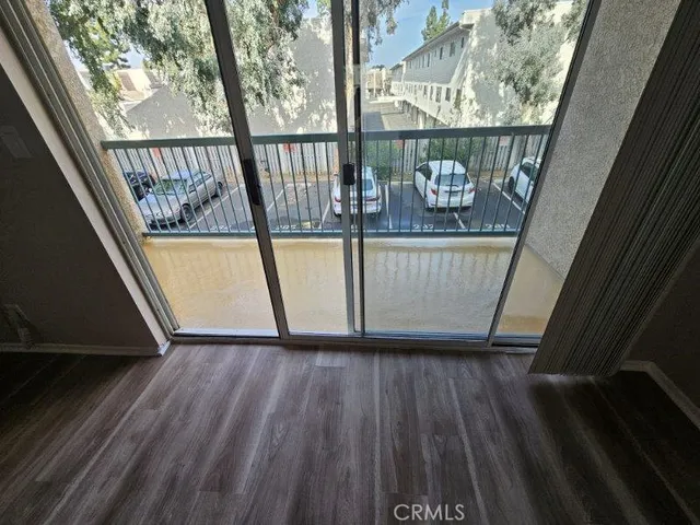 a view of a balcony with wooden floor