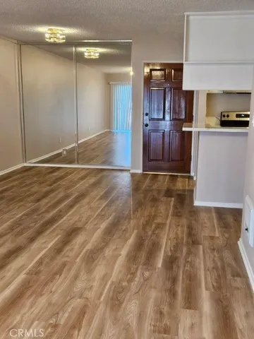 a view of a kitchen from the hallway