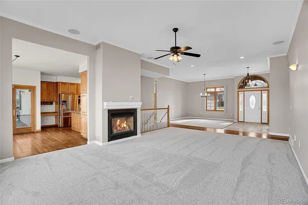 a view of a room with window and fireplace