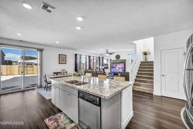 a very nice looking room with kitchen island a wooden floor