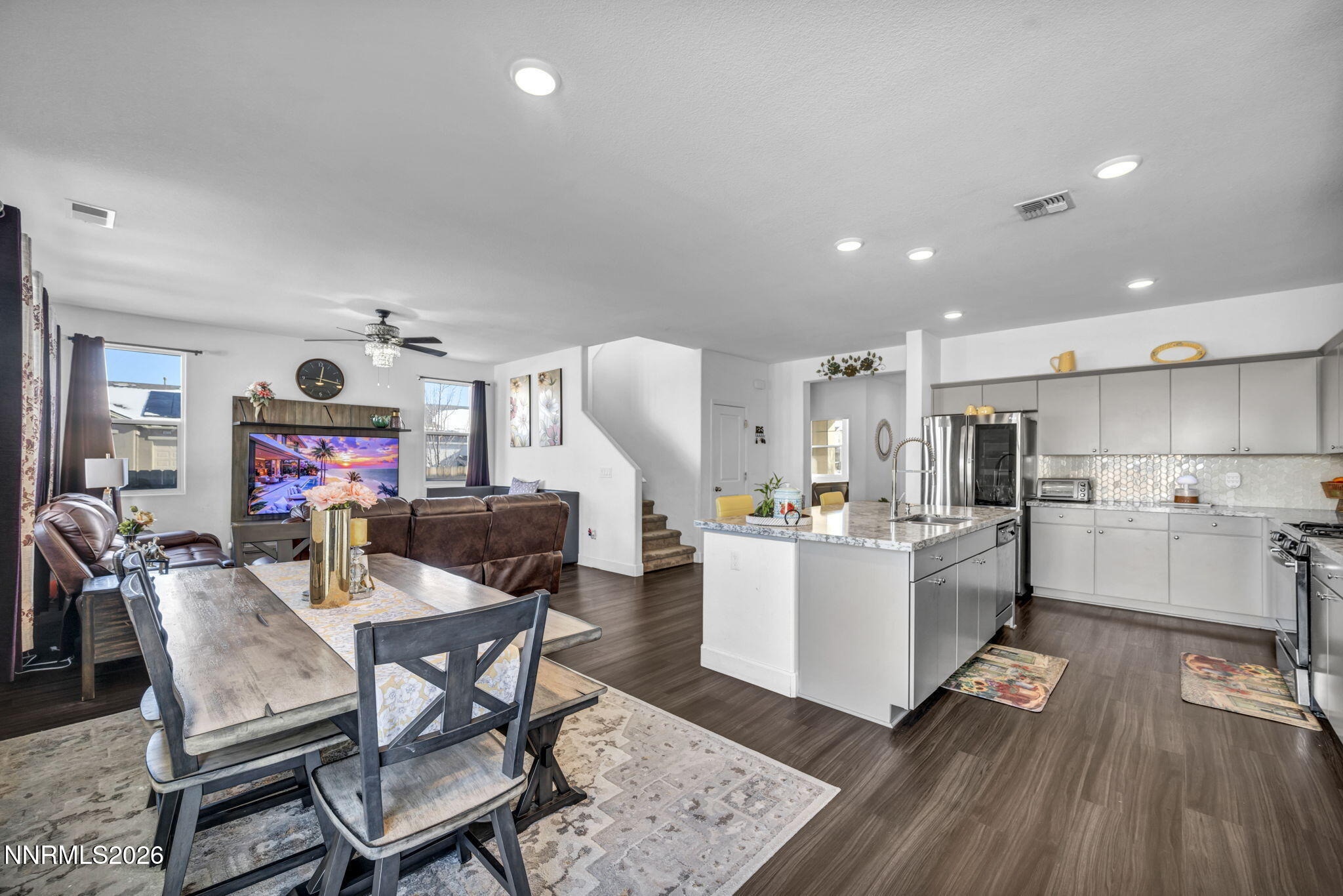 969 Estuary Circle Reno, NV 89506 - Photo 13 of 59 a living room with kitchen island furniture and a wooden floor