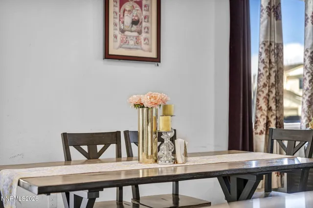 a view of a dining room with furniture and window