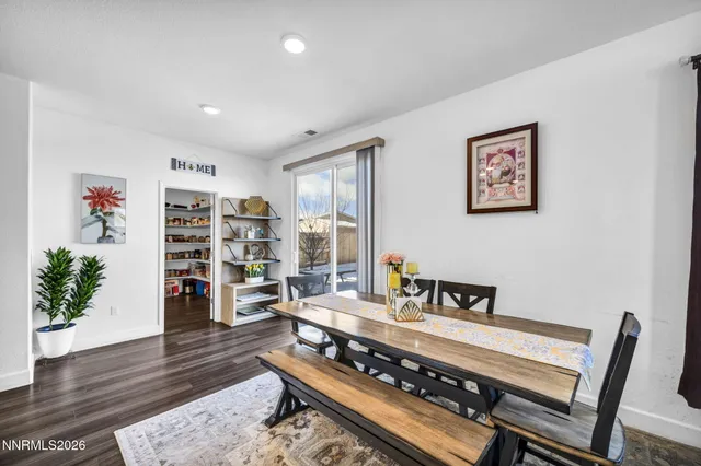 a kitchen with refrigerator and cabinets