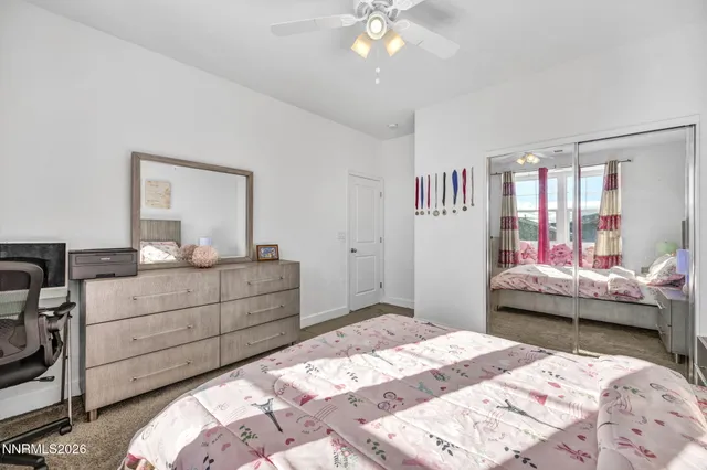 a en suite bathroom with double sink a mirror and a shower