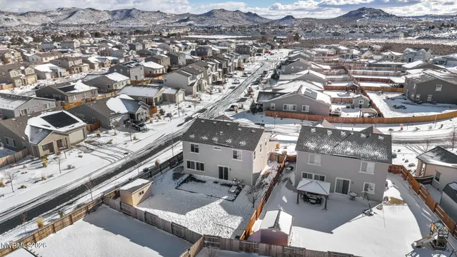 a view of a house with a snow in the yard