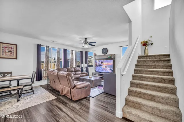 a living room with furniture and a painting