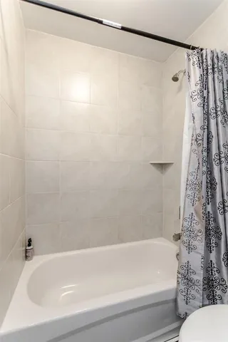 a view of a swimming pool with a balcony