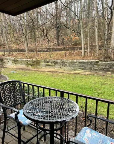 a view of swimming pool with outdoor seating