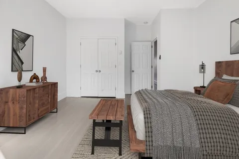 a bed room with a bed and a couch