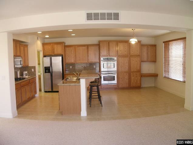 661 Caspian Court Reno, NV 89521 - Photo 3 of 9 a view of a kitchen with furniture and a kitchen